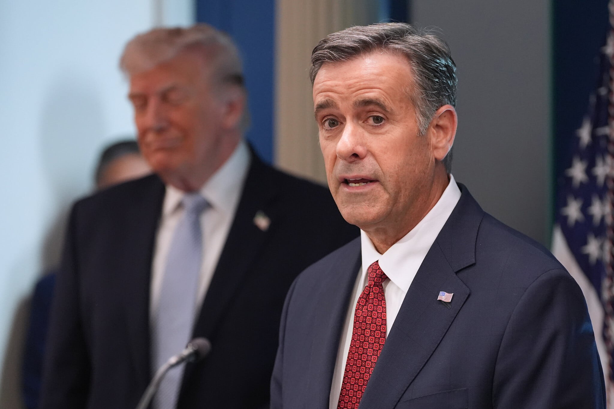 CIA Director John Ratcliffe speaks with reporters in the James Brady Press Briefing Room at the White House, April 6, 2026, as President Donald Trump looks on. (AP Photo/Alex Brandon)