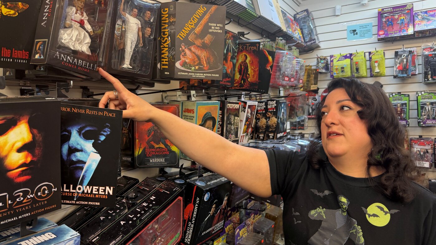 Paulina Gamino of Houston's Misfit Toys points to tariff-inflated prices on new toys that once sold for $25.